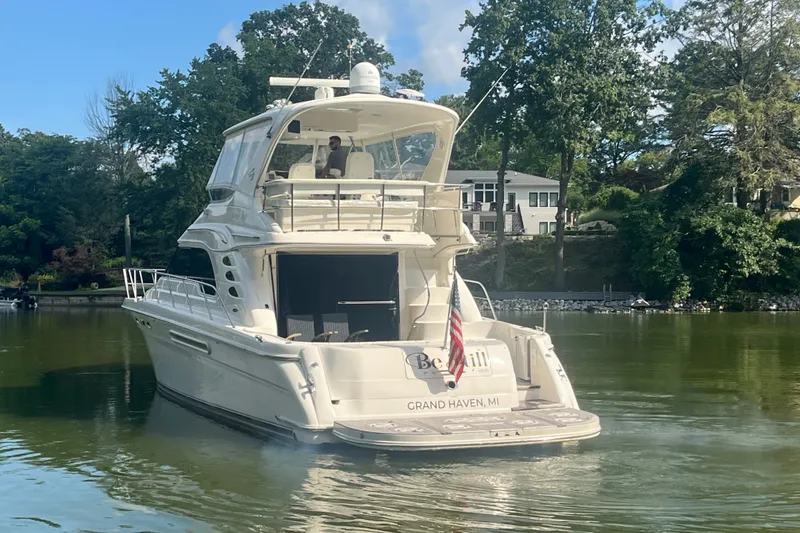 Slide: The Image of 2001 Sea Ray 560 Sedan Bridge yacht on calm water, Grand Haven, MI. - 34