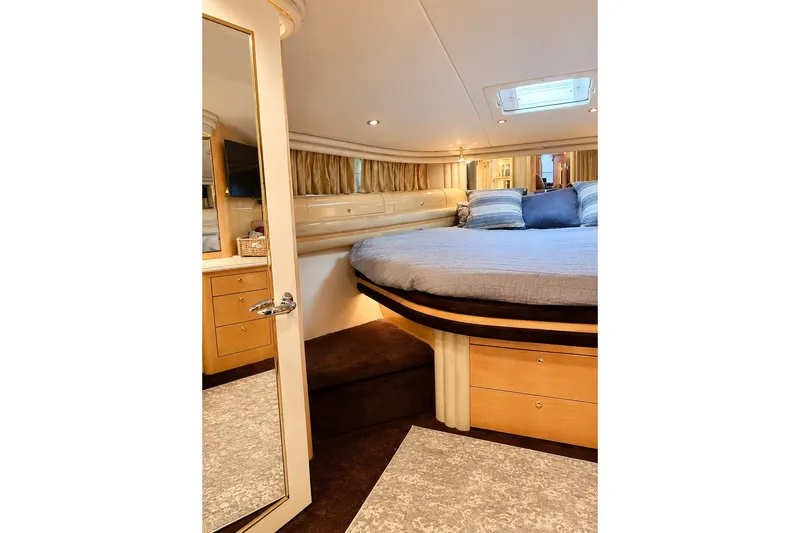 Slide: The Image of Luxurious bedroom interior of 2001 Sea Ray 560 Sedan Bridge yacht. - 22