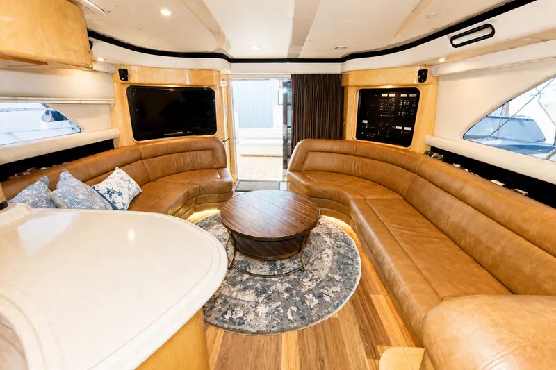 Slide: The Image of Luxurious interior of 2001 Sea Ray 560 Sedan Bridge yacht with leather seating and modern decor. - 15