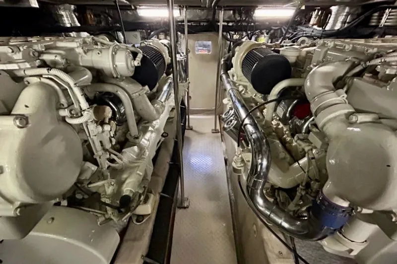 Slide: The Image of Engine room of a 2001 Sea Ray 560 Sedan Bridge yacht, showcasing dual engines. - 29