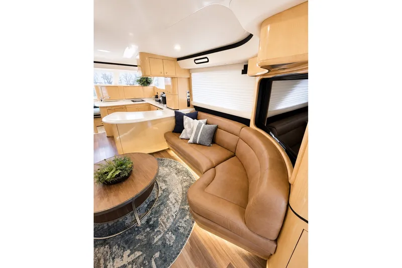 Slide: The Image of Luxurious interior of 2001 Sea Ray 560 Sedan Bridge yacht with elegant seating and modern decor. - 16
