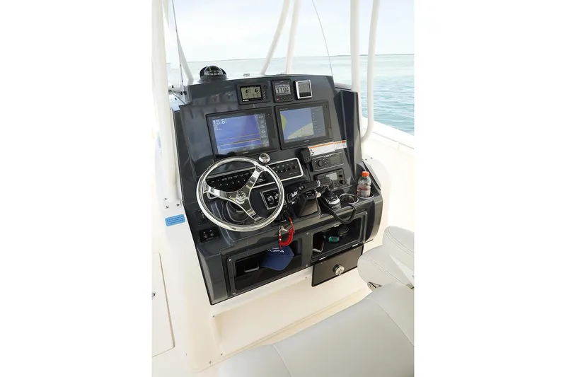Slide: The Image of Manufacturer Provided Image: 2020 Cobia 301 Center Console boat dashboard with navigation and control systems. - 7