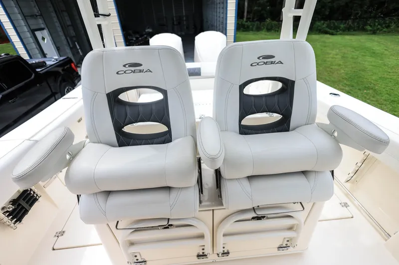 Slide: The Image of 2020 Cobia 301 Center Console boat seats with armrests in a sleek design. - 15