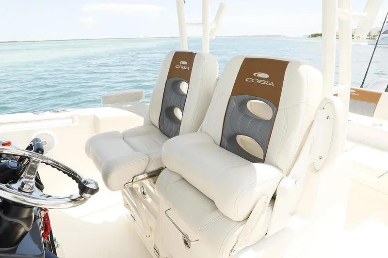 Slide: The Image of Manufacturer Provided Image: 2020 Cobia 301 Center Console boat seats with ocean backdrop. - 8