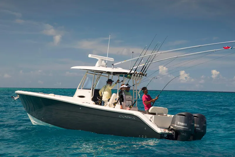 Slide: The Image of Manufacturer Provided Image: 2020 Cobia 301 Center Console boat with anglers fishing in open water. - 4