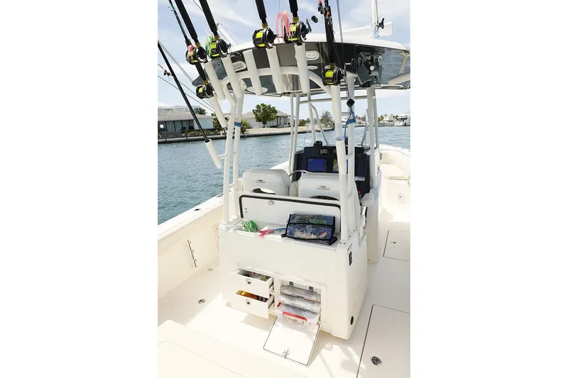 Slide: The Image of Manufacturer Provided Image: 2020 Cobia 301 Center Console boat with fishing gear and storage compartments. - 9