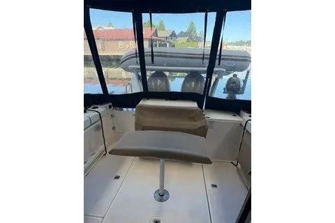 Slide: The Image of 2026 Ranger Tugs R-27 boat interior with seating and large windows. - 3