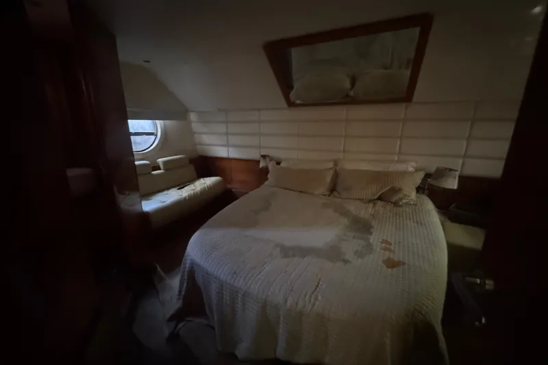 Slide: The Image of Luxurious bedroom interior of 2007 Aicon 64 yacht with round window and cozy bed. - 14