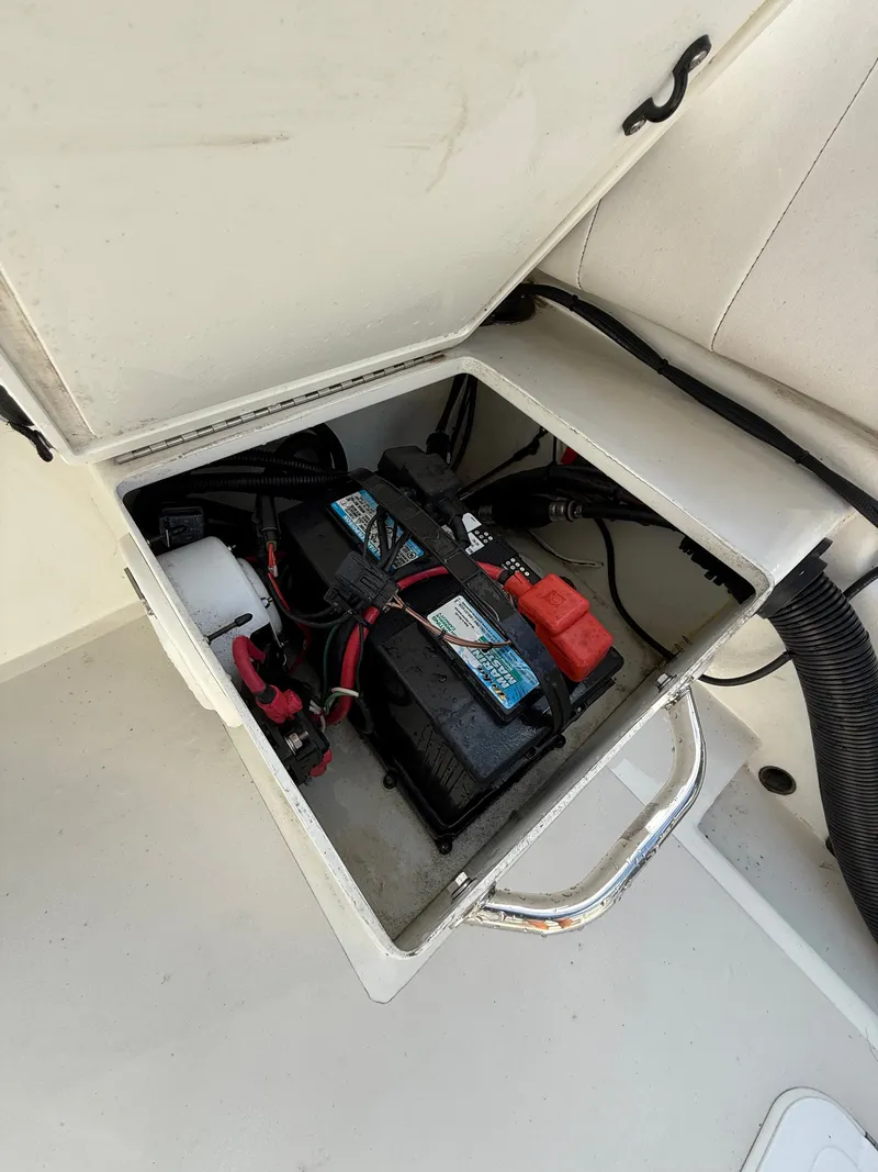 Slide: The Image of Battery compartment of a 2021 Parker 1801 Center Console boat with two batteries. - 19