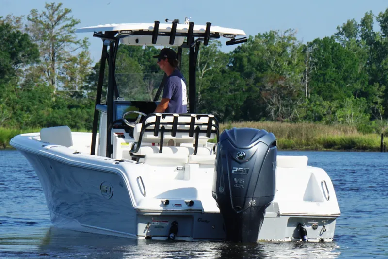 Slide: The Image of 2022 Sea Hunt Ultra 234 boat on water, featuring Yamaha V6 engine. - 3