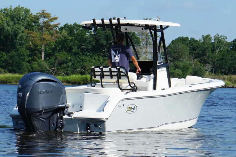 Slide: The Image of 2022 Sea Hunt Ultra 234 boat on water, featuring Yamaha outboard motor. - 5
