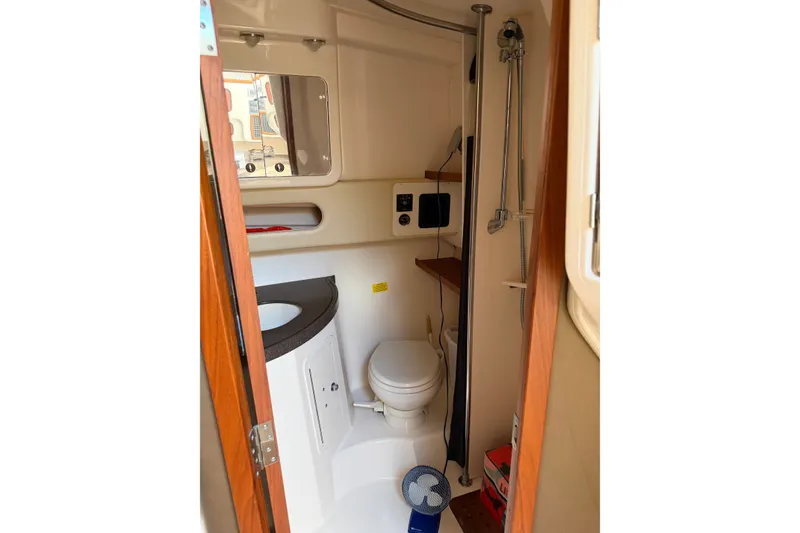Slide: The Image of 2009 Grady-White Express 360 boat bathroom with shower, sink, and toilet. - 14