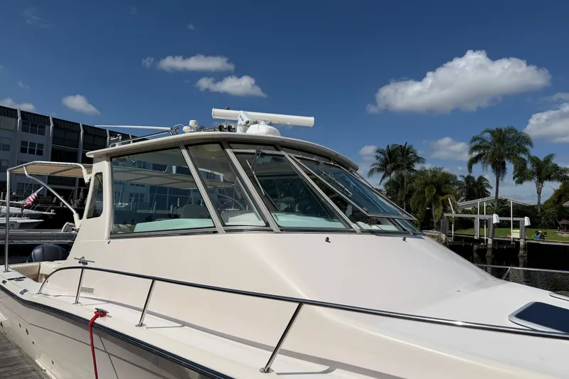 Slide: The Image of 2009 Grady-White Express 360 boat docked under clear blue sky. - 1