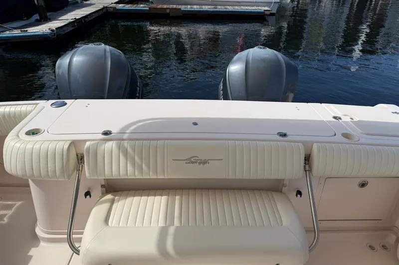 Slide: The Image of 2009 Grady-White Express 360 boat with twin outboard motors at dock. - 28