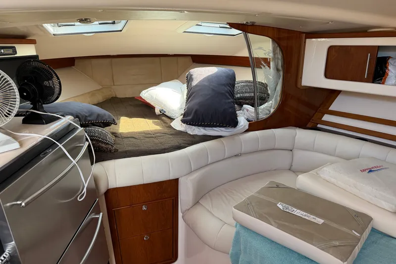 Slide: The Image of Interior of 2009 Grady-White Express 360 boat with cozy seating and bed area. - 16