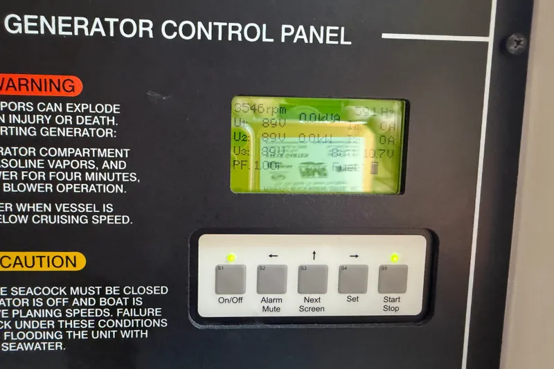 Slide: The Image of Generator control panel on a 2009 Grady-White Express 360 boat, displaying operational data. - 21