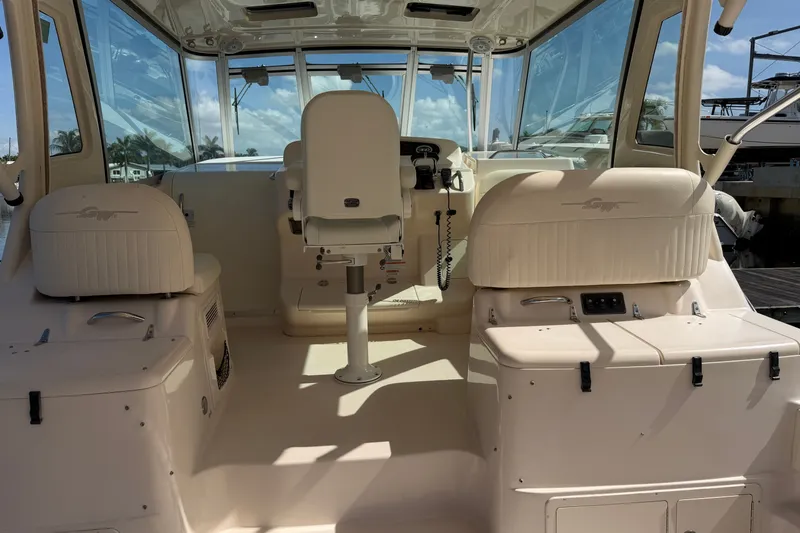 Slide: The Image of 2009 Grady-White Express 360 boat interior with helm and seating area. - 4