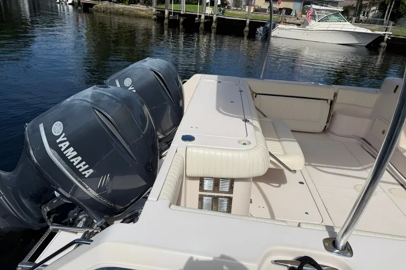 Slide: The Image of 2009 Grady-White Express 360 boat with Yamaha engines docked by the water. - 29