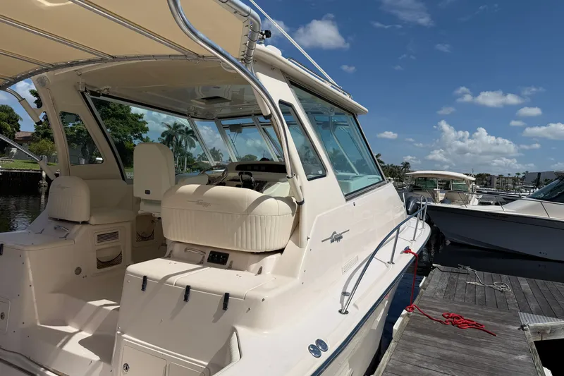 Slide: The Image of 2009 Grady-White Express 360 boat docked under clear blue sky. - 3