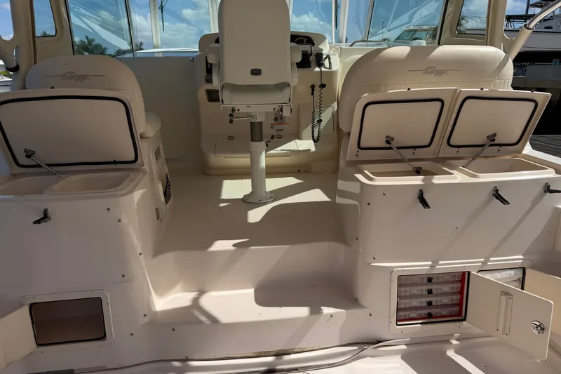 Slide: The Image of 2009 Grady-White Express 360 boat interior with seating and storage compartments. - 5
