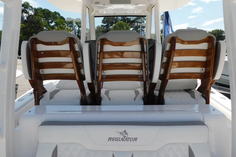 Slide: The Image of Luxury seating on a 2027 Regulator 35 boat, featuring elegant wooden accents. - 12