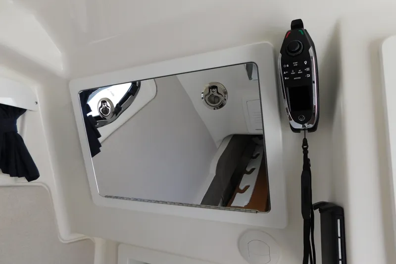 Slide: The Image of Interior of 2027 Regulator 35 boat with control panel and mirror. - 56