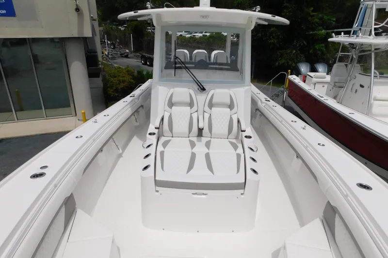 Slide: The Image of 2027 Regulator 35 boat with sleek white seating and modern design. - 18