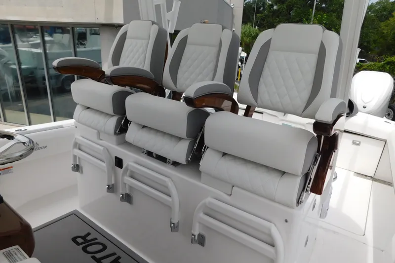 Slide: The Image of Luxury seating on 2027 Regulator 35 boat, featuring plush white and gray upholstery. - 6