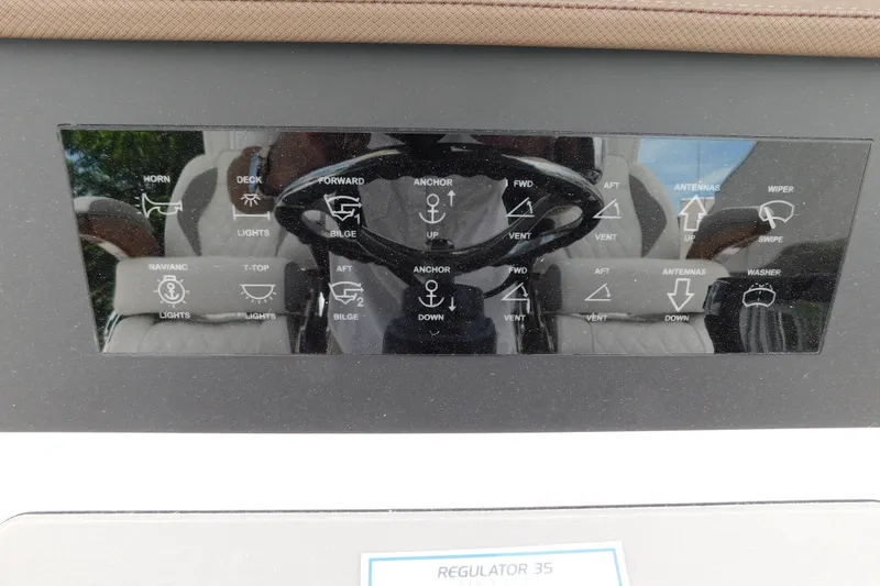 Slide: The Image of Control panel of a 2027 Regulator 35 boat with various function icons. - 41