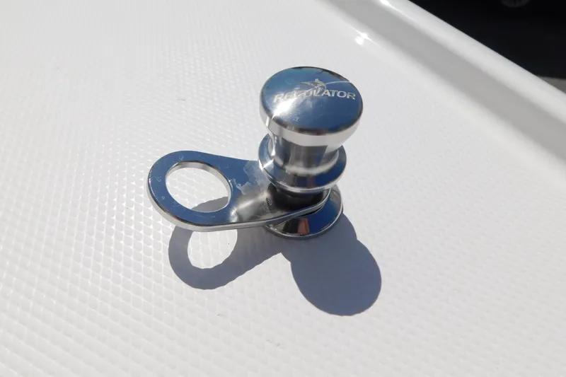 Slide: The Image of Chrome fitting on Regulator 35 boat, 2027 model, reflecting sunlight on white surface. - 68