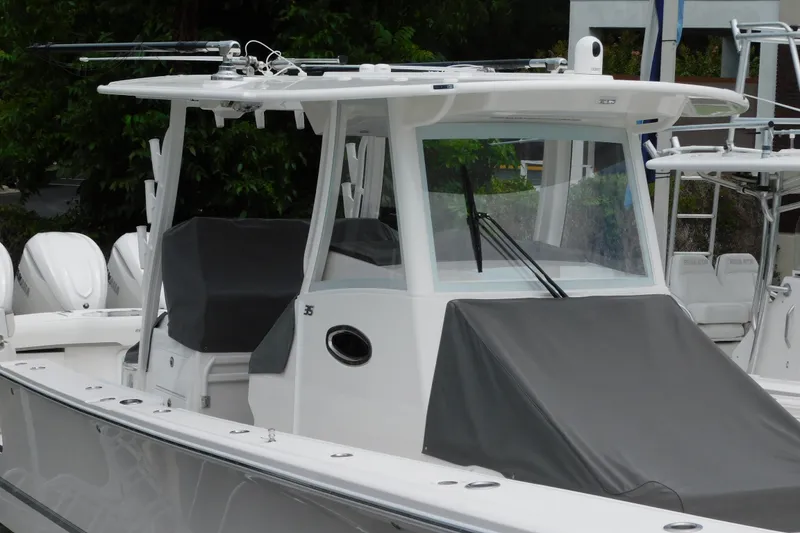 Slide: The Image of 2027 Regulator 35 boat with covered seating and advanced navigation equipment. - 27