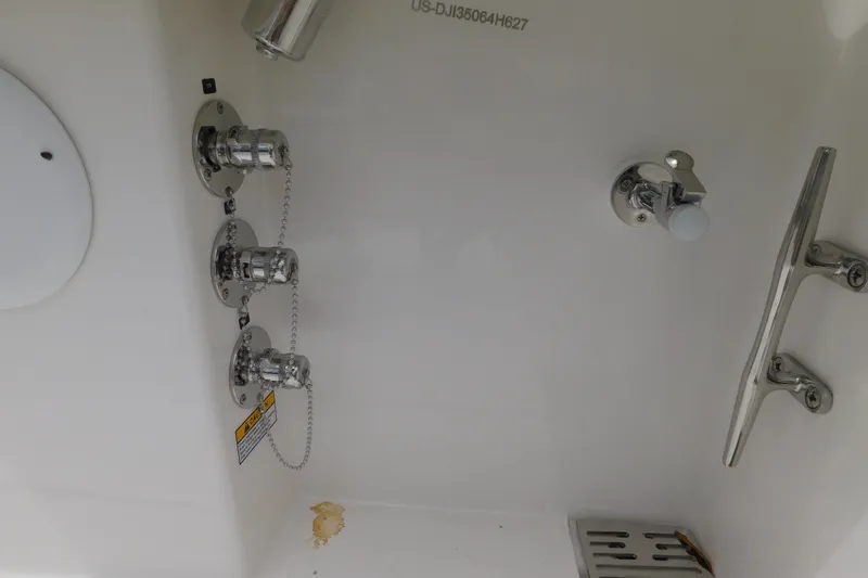 Slide: The Image of Regulator 35 boat hardware, 2027 model, featuring chrome fittings and drainage system. - 22