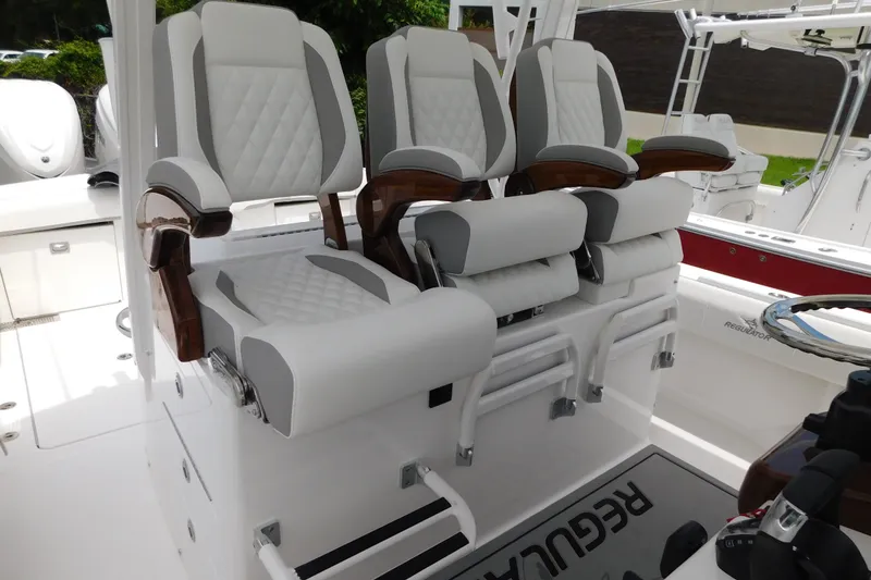 Slide: The Image of Luxury seating on a 2027 Regulator 35 boat, featuring elegant white and gray upholstery. - 4