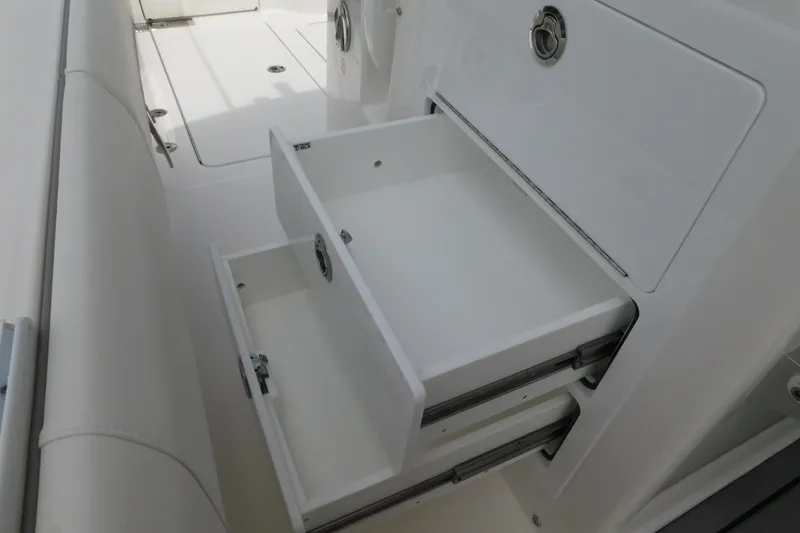 Slide: The Image of Open storage drawers on a 2027 Regulator 35 boat, showcasing sleek design and functionality. - 45