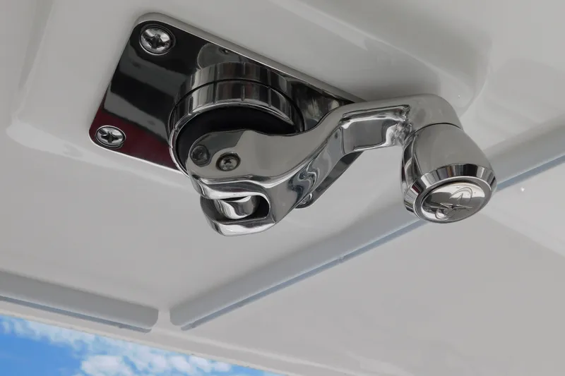 Slide: The Image of Chrome boat latch on 2027 Regulator 35, against a clear blue sky. - 40