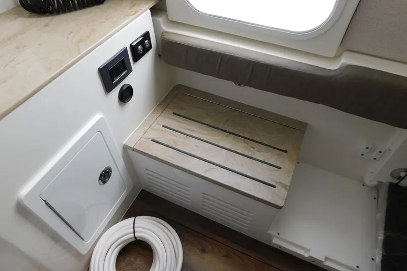 Slide: The Image of Interior of 2027 Regulator 35 boat with seating and storage area. - 61