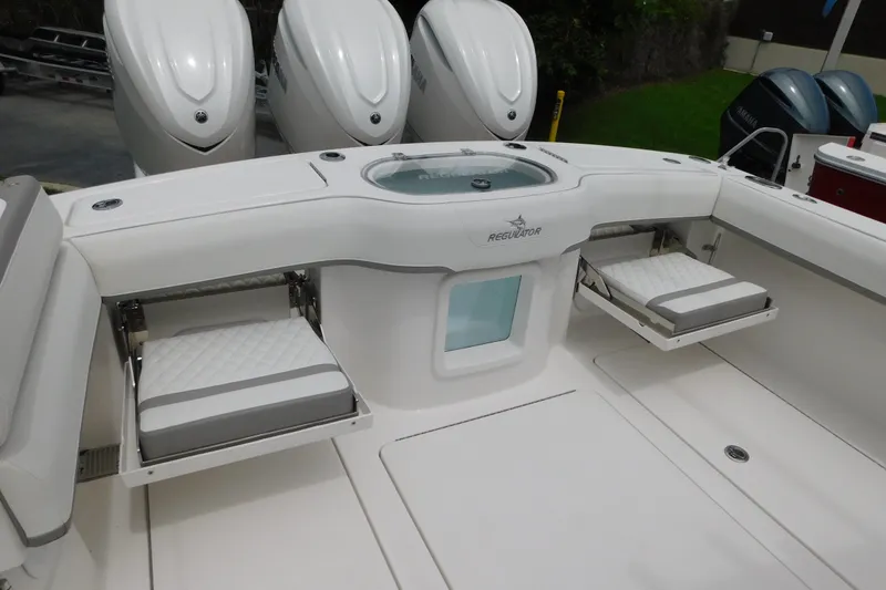 Slide: The Image of 2027 Regulator 35 boat interior with foldable seats and Yamaha outboard engines. - 17