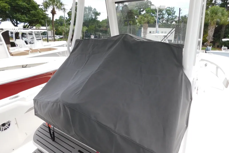 Slide: The Image of Covered console on a 2027 Regulator 35 boat, docked outdoors. - 29