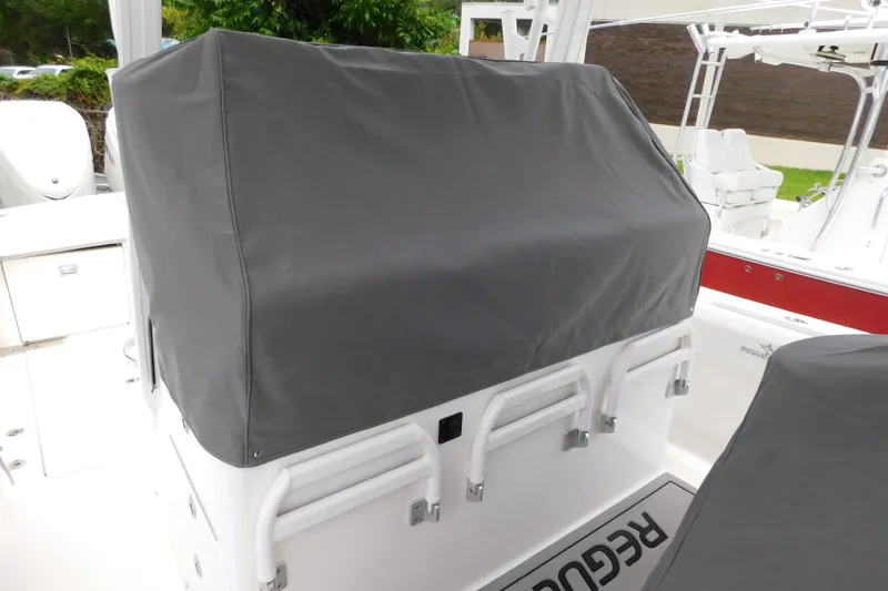 Slide: The Image of Covered console on a 2027 Regulator 35 boat, featuring protective gray fabric. - 30