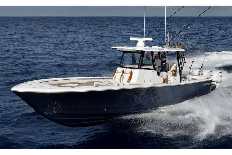 Slide: The Image of Manufacturer Provided Image: 2026 Regulator 35 boat cruising on open ocean, equipped for fishing. - 76