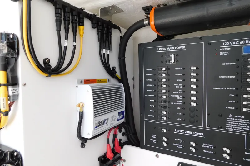 Slide: The Image of Electrical panel of a 2027 Regulator 35 boat, featuring wiring and power controls. - 52
