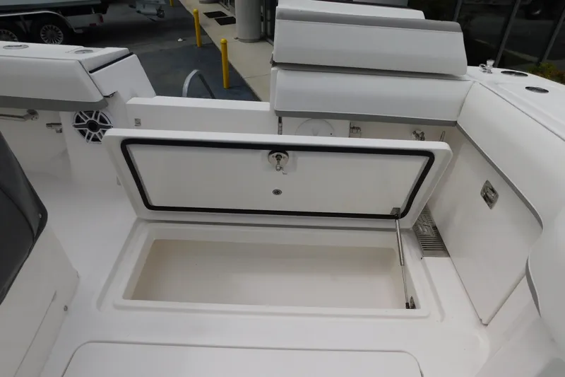 Slide: The Image of 2027 Regulator 35 boat storage compartment with open hatch, showcasing interior space. - 21