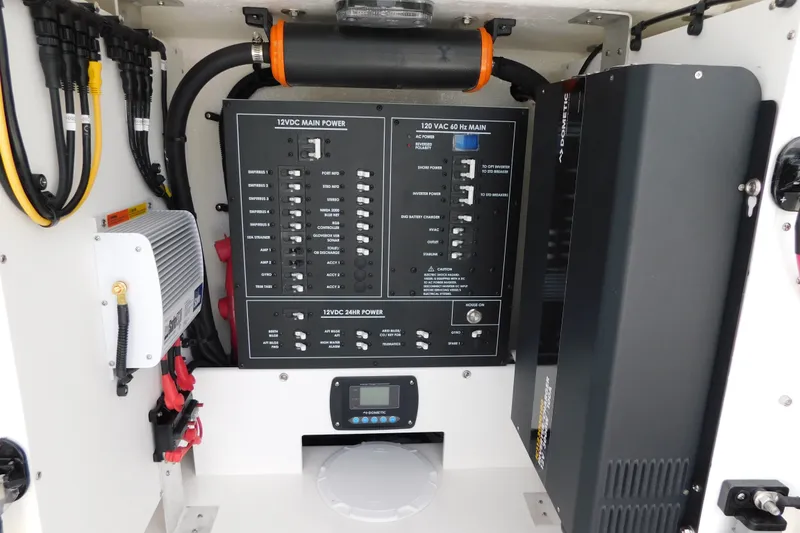 Slide: The Image of Electrical panel of a 2027 Regulator 35 boat, featuring power controls and wiring. - 46
