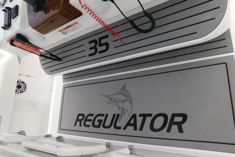 Slide: The Image of 2027 Regulator 35 boat interior with branded flooring and equipment. - 38