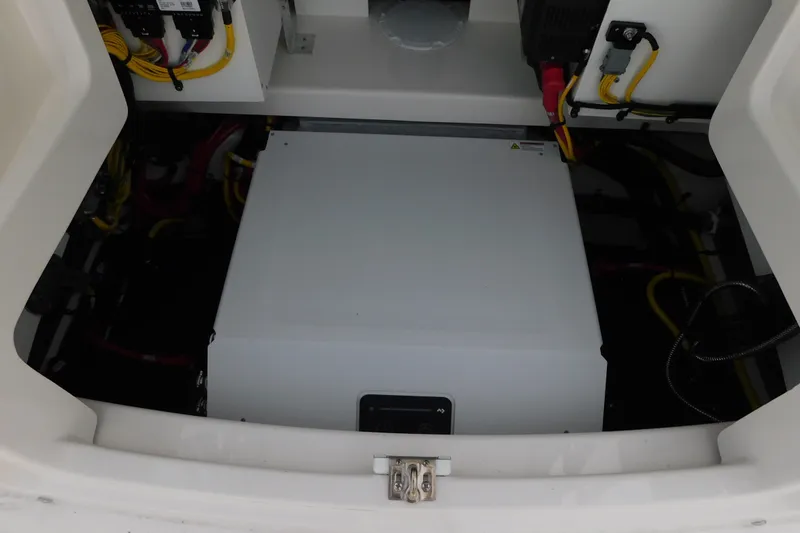 Slide: The Image of Electrical compartment of a 2027 Regulator 35 boat, showcasing wiring and components. - 48