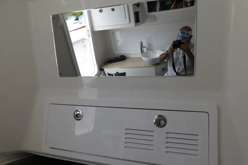 Slide: The Image of Interior of 2027 Regulator 35 boat with mirror and sink reflection. - 60