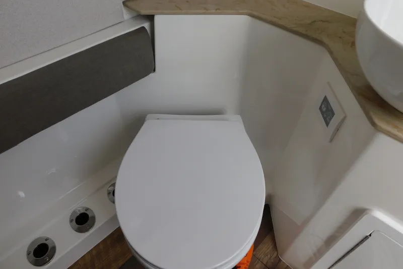 Slide: The Image of Modern bathroom in 2027 Regulator 35 boat, featuring sleek toilet design. - 57