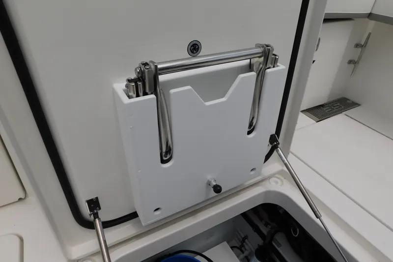 Slide: The Image of Regulator 35 (2027) boat compartment with stainless steel ladder and hydraulic supports. - 26