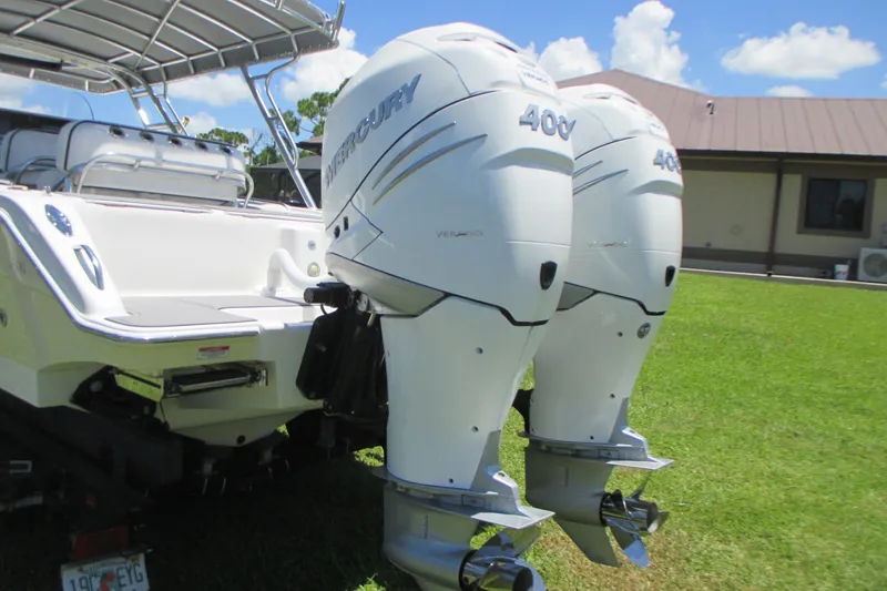 Slide: The Image of 2007 Marlago FS 35 Cuddy with twin Mercury 400 outboard engines on grass. - 8