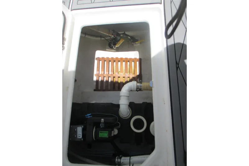 Slide: The Image of 2007 Marlago FS 35 Cuddy boat interior showing plumbing and mechanical components. - 20